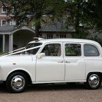 White taxi wedding hire