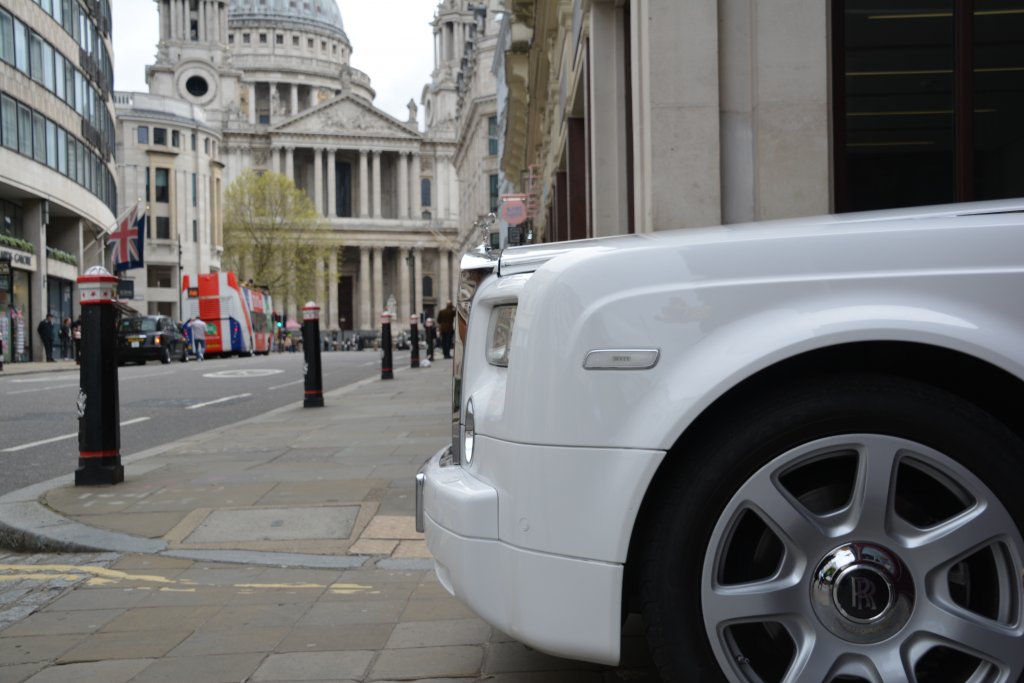 Chauffeur driven White Rolls Royce Phantom
