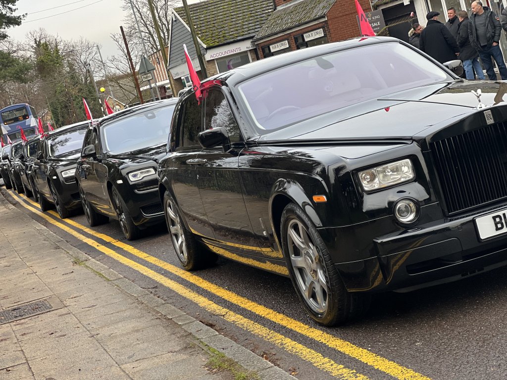 Chauffeur driven Black Rolls Royce Phantom