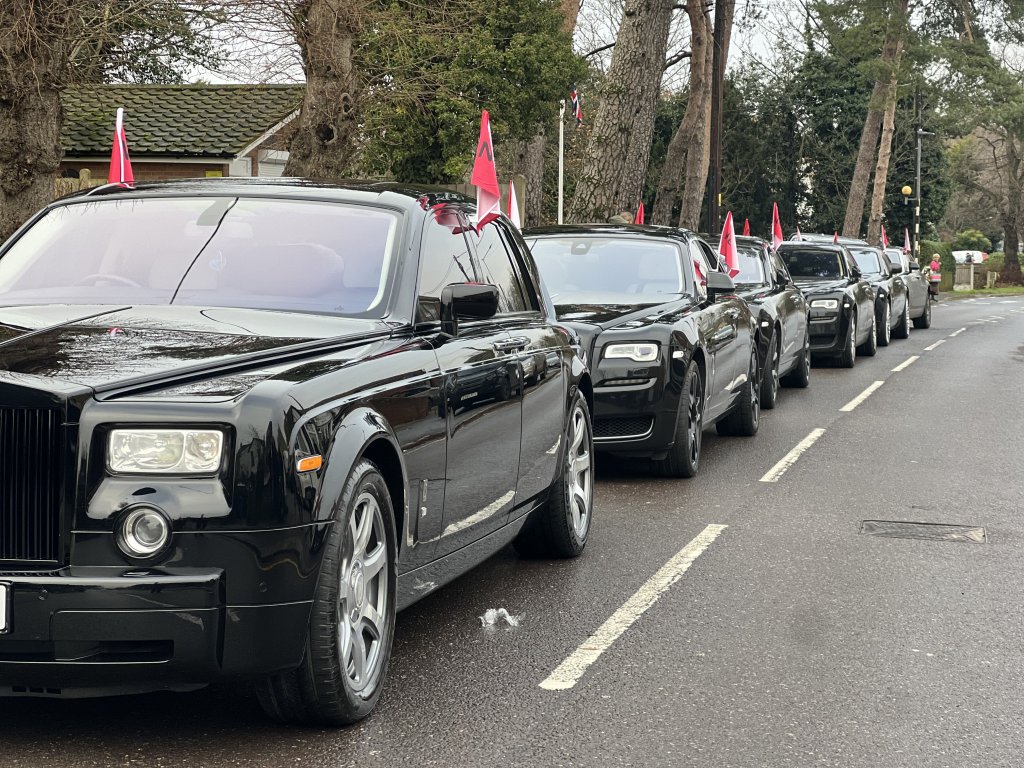 Black Funeral Rolls Royce's