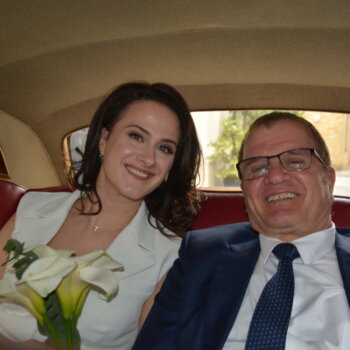 Bride and father in wedding car