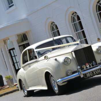 White classic Rolls Royce manor of groves