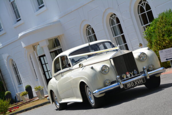 White classic Rolls Royce manor of groves